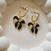 Noir Bow Pearl Huggy Earrings
